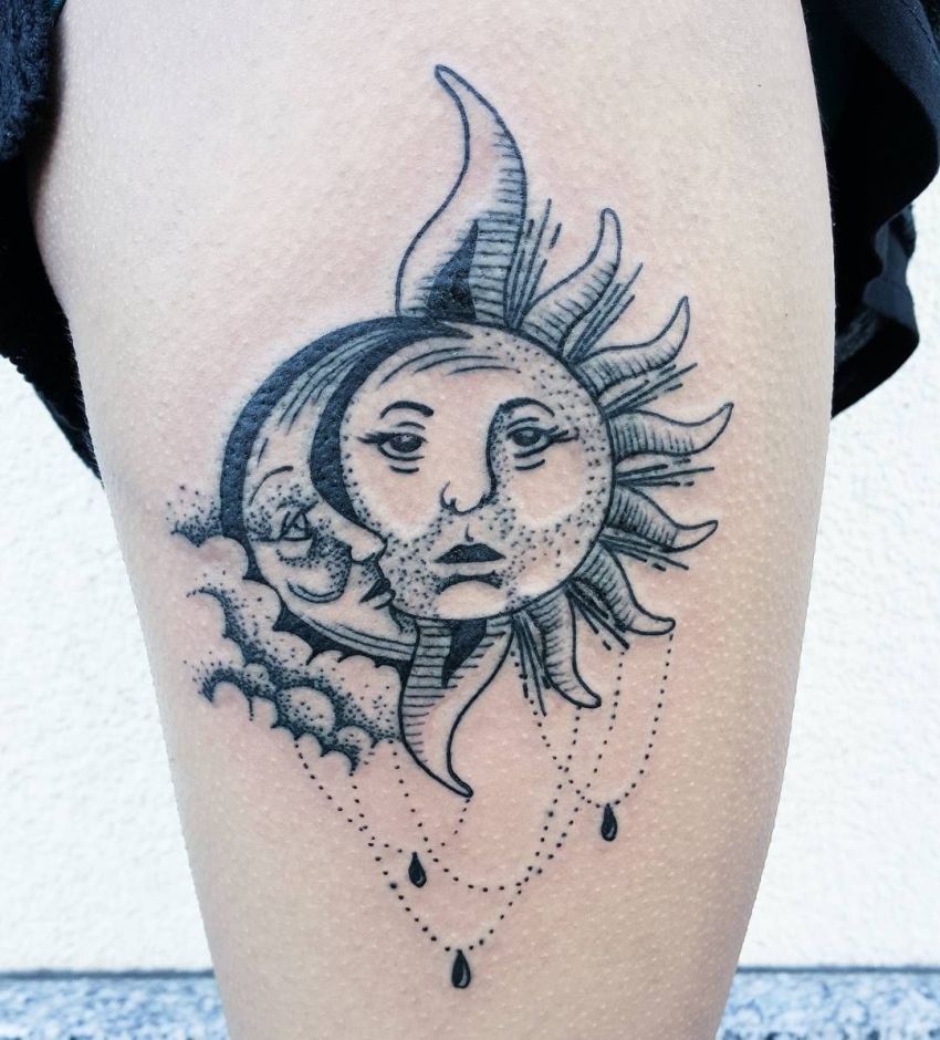 Fine line sun and moon tattoo on the inner forearm.