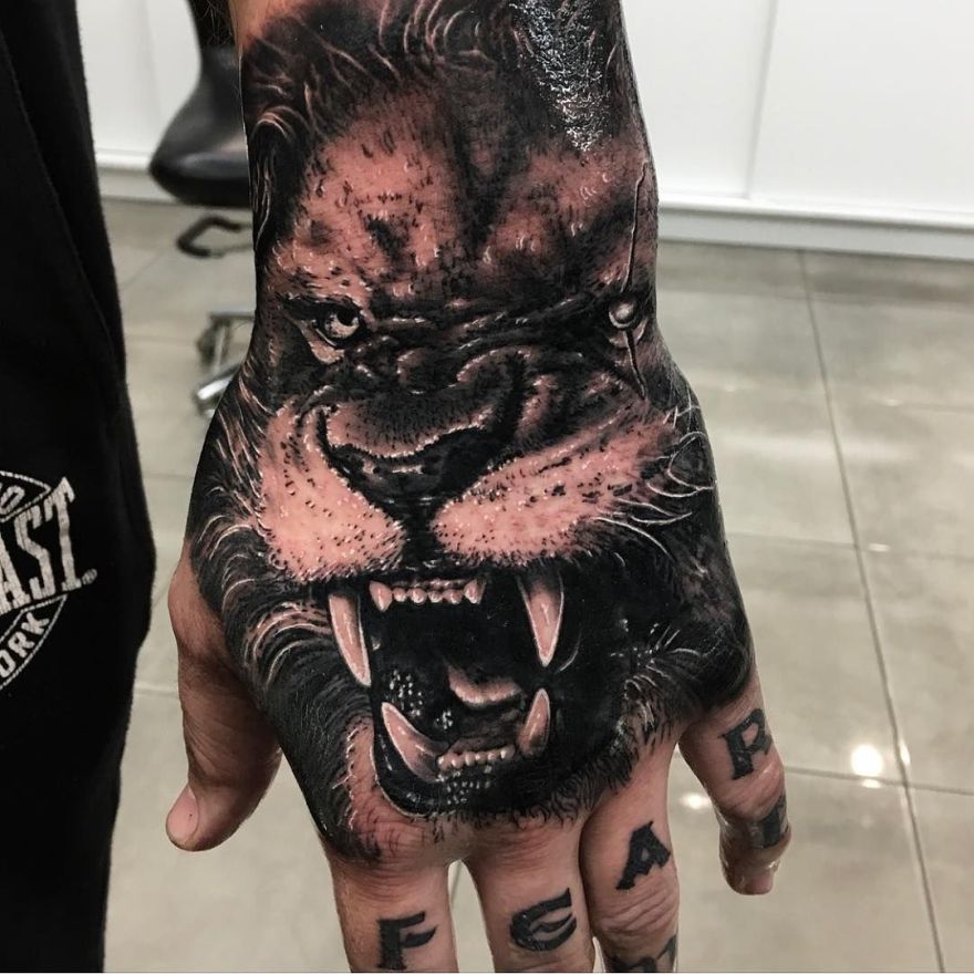 black and grey realistic tattoo
