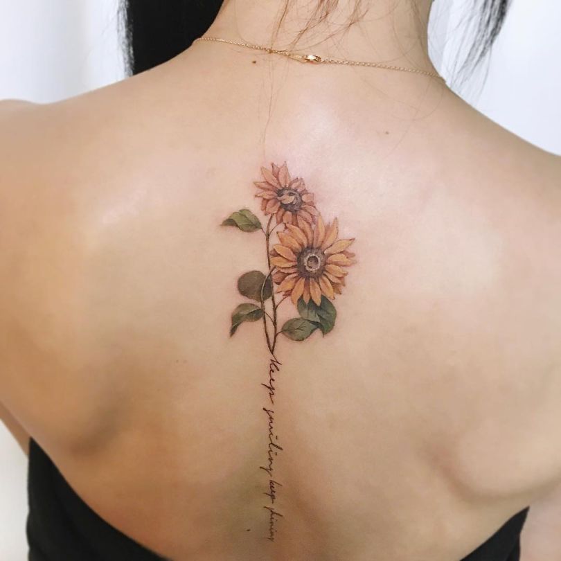 spine sunflower tattoo