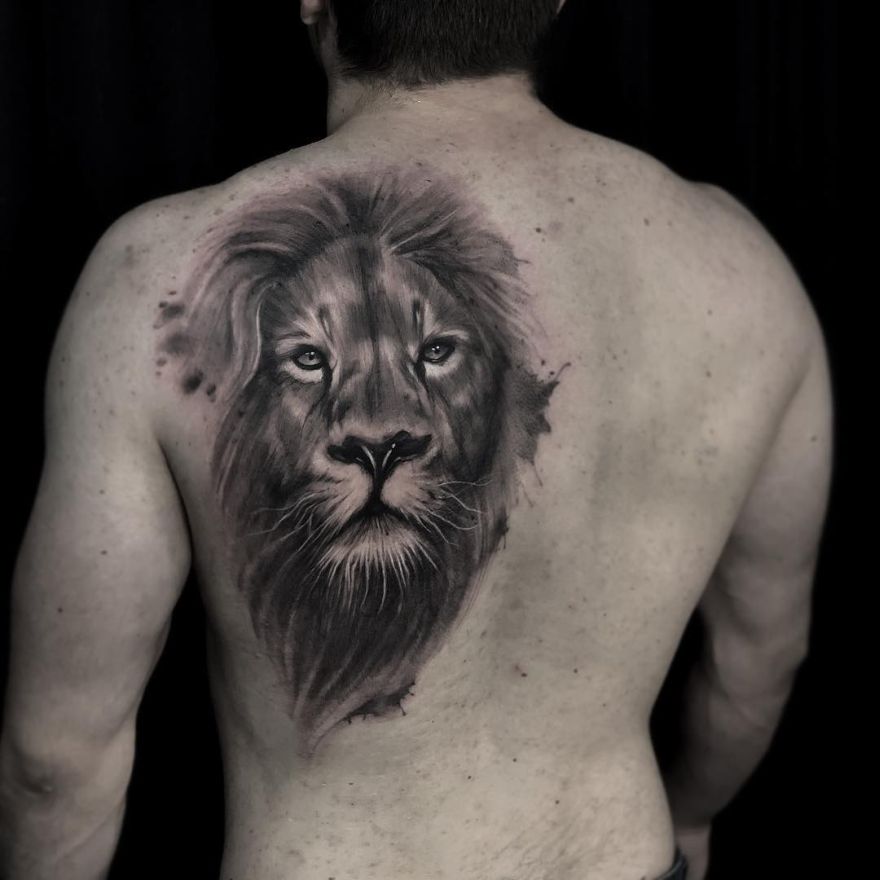 Realistic lion tattoo on the left inner forearm.