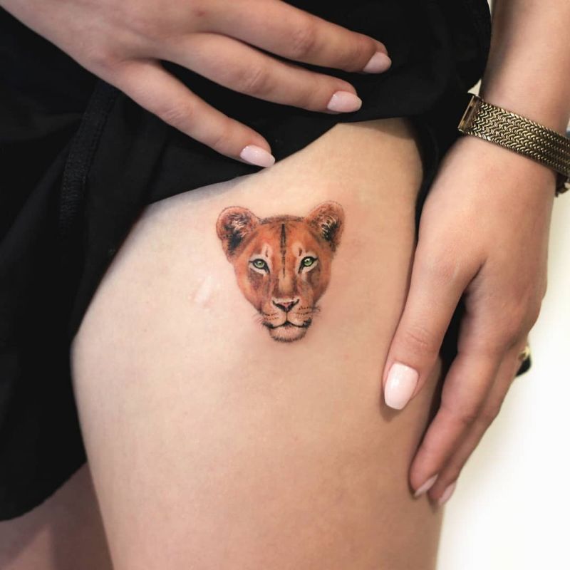 colored lioness tattoo
