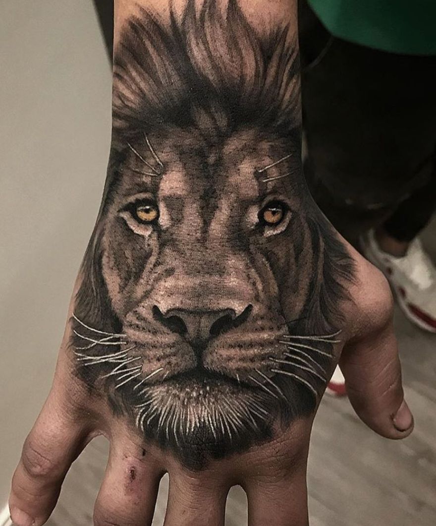 hand lion tattoo