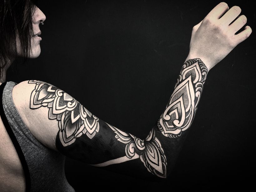 These Striking Solid Black Tattoos Will Make You Want To Go All In