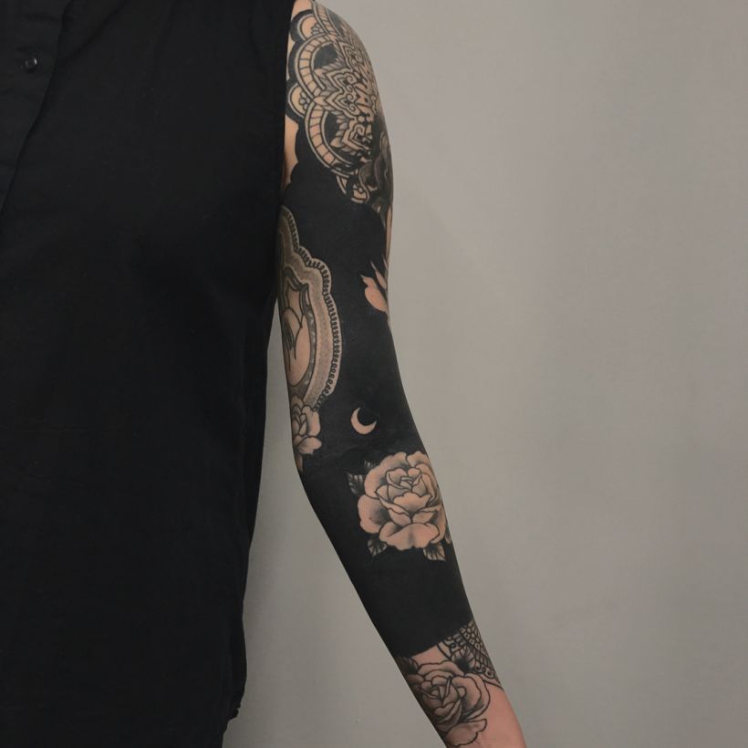 These Striking Solid Black Tattoos Will Make You Want To Go All In