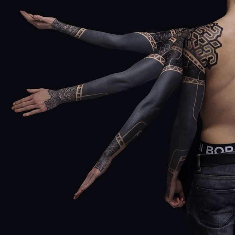 These Striking Solid Black Tattoos Will Make You Want To Go All In