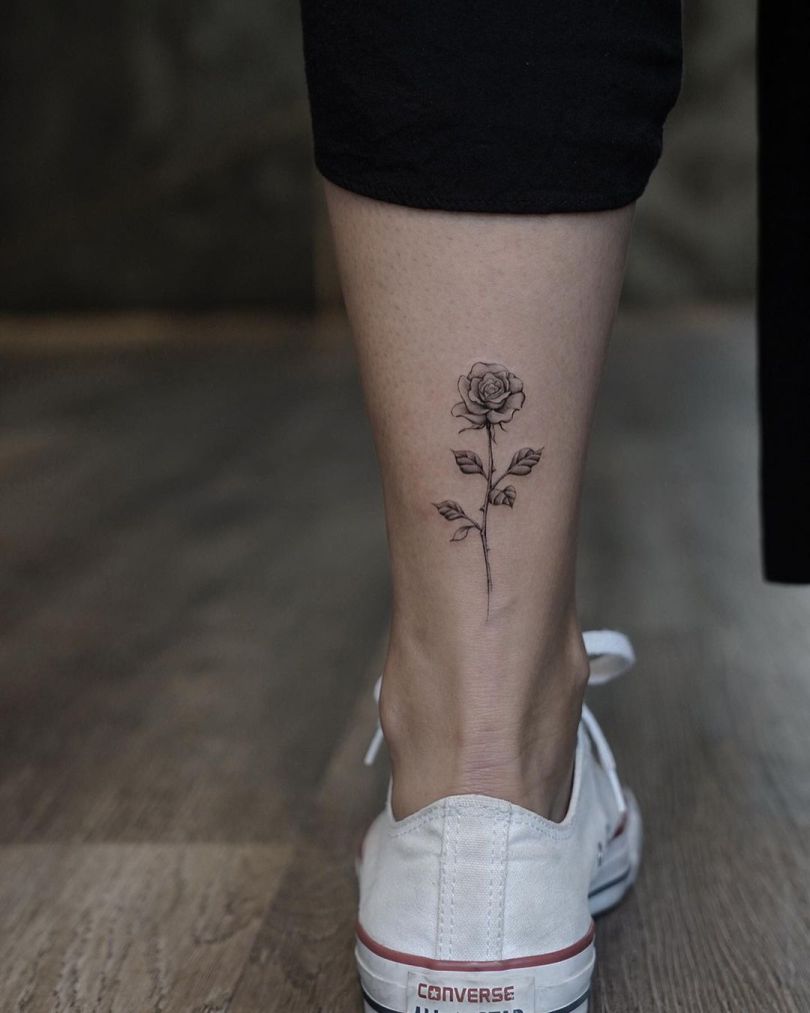 rose tattoo on leg
